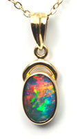 18k gold pendant with a solid boulder opal