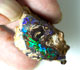 Polished boulder opal specimen